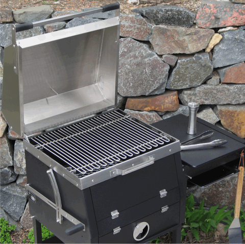 The B1 backyard charcoal grill with cover open showing how the work space is configured